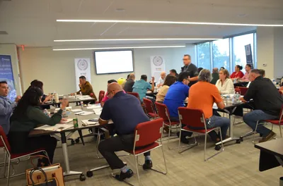 CreateInterest leadership training session with Moises Solis facilitating team development workshop
